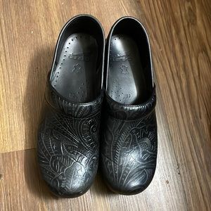 Dansko clog, worn about a year, slight signs of wear to heel.